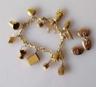 A yellow gold charm bracelet, 17 cm and 1 1/2 oval rose gold cufflinks
