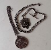 A 1951 silver crown on a silver mount and chain and a silver Albert chain with T-bar, 39 cm