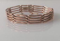 A Victorian 9ct rose gold gate-link bracelet with textured design, 18 cm, hallmarked