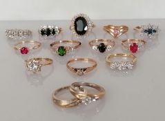 An assortment of fourteen 9ct yellow gold gem-set rings, all hallmarked, 36g (14)