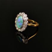 Ausgefallener Opal-Ring, 750/18K Weiß-/Gelbgold (punziert), Gesamtgewicht 4,41g, mittig ovaler Opal