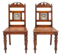 A pair of Victorian oak hall chairs in Aesthetic Movement style,