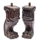A pair of carved walnut monopodia in Baroque style,