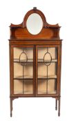 An Edwardian mahogany, line inlaid and glazed display cabinet,