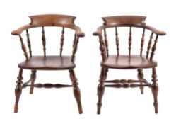 Two similar oak and elm 'smokers' bow' elbow chairs,