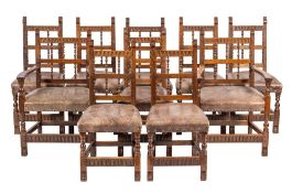 A set of ten carved oak and leather upholstered dining chairs in Jacobean style,