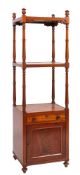 An early Victorian mahogany etagere with cupboard; circa 1840;