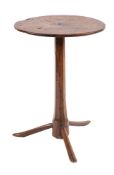 A primitive oak and pollard oak circular occasional table,