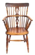 A Victorian elm and oak Windsor elbow chair,