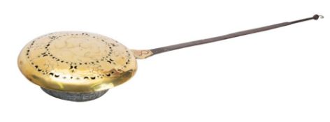 An early 18th century brass and iron warming pan of circular form with hinged and pierced brass lid