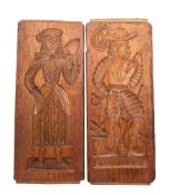 Two large Dutch gingerbread moulds carved to depict a gentleman and female in early 17th century