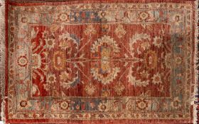 A Turkish mat with an ivory ground geometric design compartmented field, 138cm x 58cm,