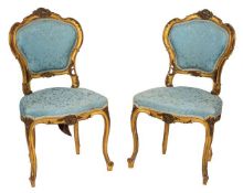 A pair of carved and giltwood and upholstered side chairs in Louis XV style,