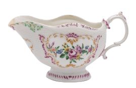 A First Period Worcester polychrome sauceboat moulded with rococo cartouches on an osier ground,