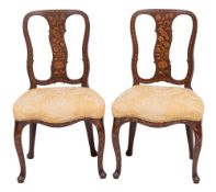 A pair of Dutch walnut and marquetry side chairs,