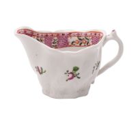A Caughley creamboat of Low-Chelsea ewer type painted in the Chinese export style with flower