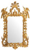 A carved and giltwood framed wall mirror in late George II Rococo style,