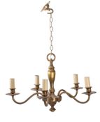 A brass four branch chandelier with central knopped stem with four scrolling branches terminating