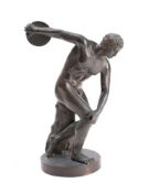 After the Antique, a bronze study of the Discobolus of Myron mounted on a plain circular base, 23.