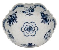 A First Period Worcester blue and white junket dish moulded with foliage and shells,
