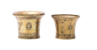 Two Eastern brass beakers of flared cylindrical outline,