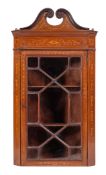 A mahogany and marquetry hanging corner cabinet in George III style,