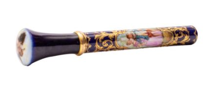 A Continental porcelain parasol handle decorated front and verso with quadrilobed panels containing