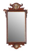 A parcel gilt framed walnut wall mirror in George I taste,
