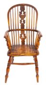 A Victorian elm and oak Windsor elbow chair,