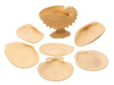An unusual Wedgwood Nautilus shell caneware part dessert service in unglazed buff-coloured