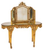 A giltwood and composition kidney shaped dressing table in Louis XV taste,