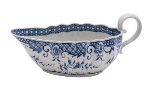 A First Period Worcester blue and white sauceboat of oval fluted form,