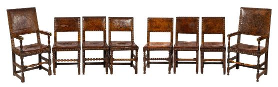 A group of eight oak and leather upholstered dining chairs,