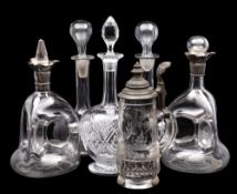 A Bohemian glass stein and five decanters and stoppers,