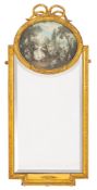 A giltwood and composition framed wall mirror in Louis XVI taste,