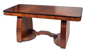 An Art Deco walnut and ebonised dining table, circa 1930,