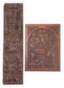A relief carved oak rectangular panel, 17th century with female mask enclosed by scrolls,