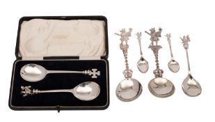 A matched pair of silver Trusty Servant serving spoons,