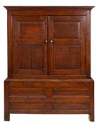 A George II oak cupboard,