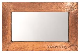 A copper framed rectangular wall mirror in Arts & Crafts style,