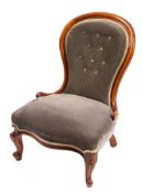 A Victorian walnut and velvet button upholstered nursing chair,