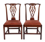 A pair of George III mahogany side chairs,