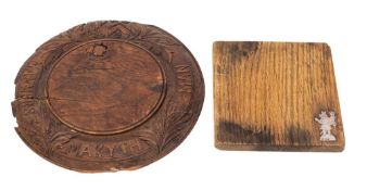 A Victorian oak bread board, last quarter 19th century; circular, with plain,