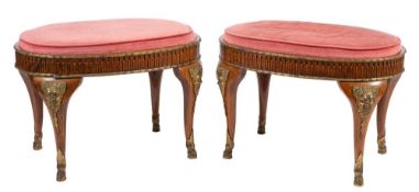 A pair of walnut and gilt bronze mounted oval stools in Louis XVI taste,