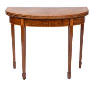 A George III mahogany, crossbanded and line inlaid D-shaped card table,
