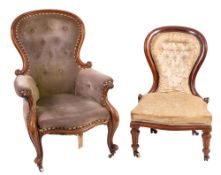 A Victorian carved walnut and button upholstered armchair,