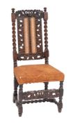 A Charles II carved walnut and canework side chair, circa 1670,