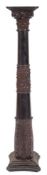 A Victorian carved and ebonised wood columnar pedestal, possibly Irish,