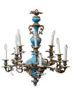A late 19th century French gilt metal and blue glass mounted twelve branch chandelier in rococo
