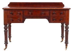 A Victorian mahogany dressing table, mid 19th century; the top with back gallery,